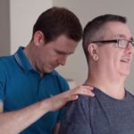 physiotherapist Fraser treating David in his upper back to reduce his pain