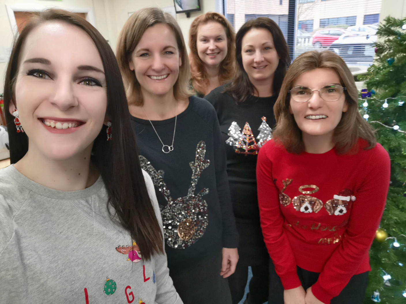 Admin team in christmas jumpers