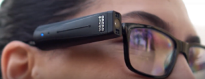 OrCam camera mounted on arm of glasses