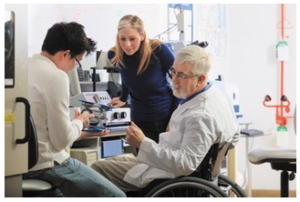 scientist in wheelchair working in laboratory