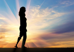 Woman walking with a prosthetic leg